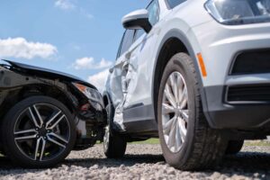 Distracted driving accidents: white car hit on the passenger side by another car