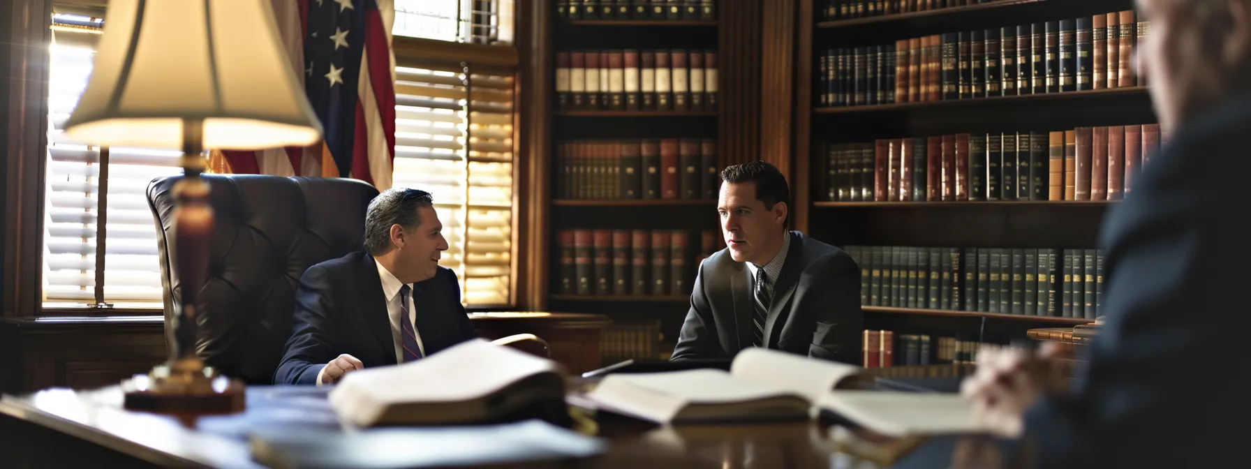 a focused interior shot of a professional lawyer's office, featuring a confident attorney in a tailored suit engaged in a serious discussion with a client, surrounded by law books and legal documents, emphasizing trust and expertise in handling truck accident cases.